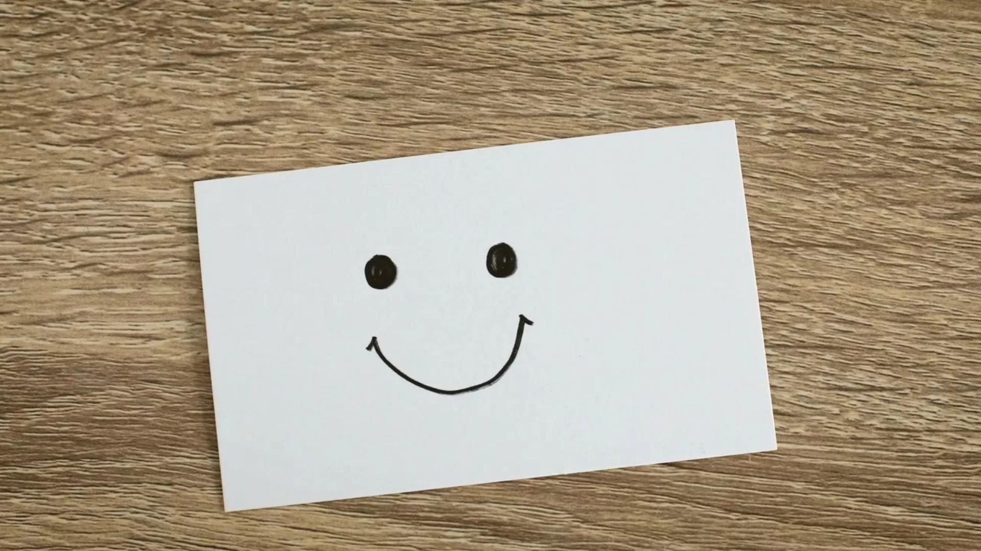 Piece of paper with smiley face to demonstrate communication for leaders