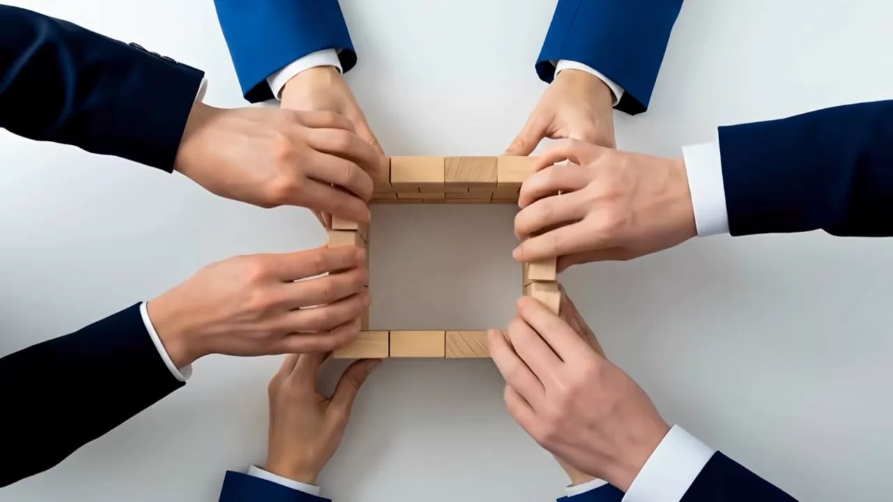 leaders building with wooden blocks