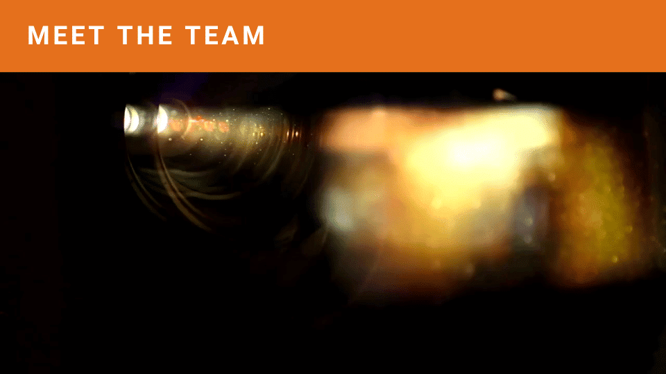 Meet The Team Meet The Team words on an orange band with a show reel image